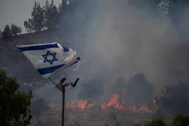 Hezbollah rains rockets on Israel after strike kills commander